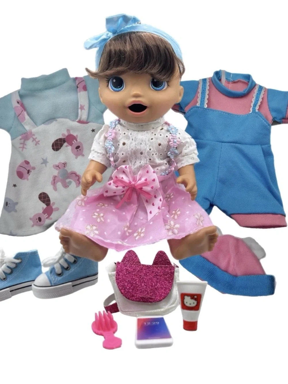 Dress-Up Baby Doll with Pink Floral Skirt and Blue Accessories